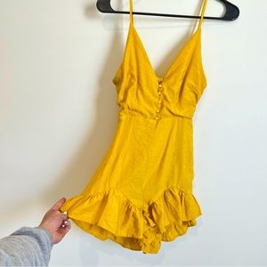Yellow ruffle open back romper